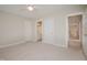 Bedroom with carpet, ceiling fan, and access to bathroom and hallway at 3021 Glenwood Dr, Durham, NC 27705