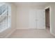 Bedroom featuring carpet, natural light, and a closet at 3021 Glenwood Dr, Durham, NC 27705
