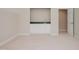 Spacious bonus room features a wet bar with a sink and white cabinets with gold hardware at 3021 Glenwood Dr, Durham, NC 27705