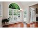 Sunlit breakfast nook with large windows and views of the surrounding greenery at 3021 Glenwood Dr, Durham, NC 27705
