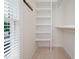 Walk-in closet with adjustable shelving offers ample storage space at 3021 Glenwood Dr, Durham, NC 27705