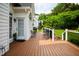 Back deck with view of white fence and houses with wrought iron patio set at 3021 Glenwood Dr, Durham, NC 27705