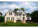 Charming two-story brick home with manicured lawn and mature landscaping at 3021 Glenwood Dr, Durham, NC 27705