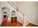 Welcoming foyer with staircase, hardwood floors, and open layout at 3021 Glenwood Dr, Durham, NC 27705