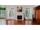 Cozy living room features a marble fireplace and bright natural light from the windows at 3021 Glenwood Dr, Durham, NC 27705