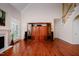 Large living room with hardwood floors, fireplace, and built in entertainment center at 3021 Glenwood Dr, Durham, NC 27705