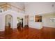 Spacious open-concept living area with hardwood floors flowing into the dining and kitchen areas at 3021 Glenwood Dr, Durham, NC 27705