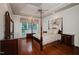 Relaxing main bedroom with a four-poster bed, hardwood floors, and a large window at 3021 Glenwood Dr, Durham, NC 27705
