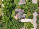 Aerial view of a home with a large backyard, patio area, and driveway at 304 Cayman Ave, Holly Springs, NC 27540