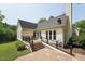 A well-maintained backyard with a wooden deck and patio at 304 Cayman Ave, Holly Springs, NC 27540