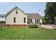 The backyard features a well-manicured lawn and access to a patio at 304 Cayman Ave, Holly Springs, NC 27540