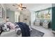 Cozy bedroom showcasing neutral decor, comfortable seating, and a bright window view at 304 Cayman Ave, Holly Springs, NC 27540