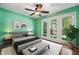 Comfortable primary bedroom with natural light, hardwood floors and ample space at 304 Cayman Ave, Holly Springs, NC 27540