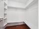 Functional walk-in closet features custom shelving and ample storage space at 304 Cayman Ave, Holly Springs, NC 27540