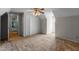 Spacious carpeted bedroom with large closet and a view of the home's architecture at 304 Westfield Dr, Dunn, NC 28334
