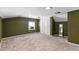 Spacious carpeted bedroom featuring a window, closet, and neutral toned walls at 304 Westfield Dr, Dunn, NC 28334