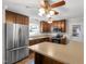 Updated kitchen featuring stainless steel appliances, ample counter space, and a ceiling fan at 304 Westfield Dr, Dunn, NC 28334