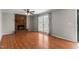 Bright living room with a brick fireplace, hardwood floors, and a sliding glass door at 304 Westfield Dr, Dunn, NC 28334