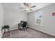 Bedroom featuring neutral paint and carpet flooring, with a large window for natural light at 309 Highland Forest Dr, Fuquay Varina, NC 27526