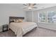 Cozy bedroom featuring a ceiling fan, and a large window for plenty of light at 309 Highland Forest Dr, Fuquay Varina, NC 27526