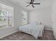 Bright bedroom with a ceiling fan and large windows allowing for ample natural light at 309 Highland Forest Dr, Fuquay Varina, NC 27526