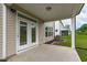 Covered patio with a concrete floor and easy access to a level yard at 309 Highland Forest Dr, Fuquay Varina, NC 27526