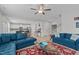 Open-concept living space with comfortable seating, hardwood floors, and abundant natural light at 309 Highland Forest Dr, Fuquay Varina, NC 27526