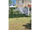 Backyard view of the house with a green fence and some trees at 3207 Geary Trl, Raleigh, NC 27610