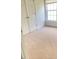 This is a carpeted bedroom featuring a window and double door closet for optimal space and lighting at 3207 Geary Trl, Raleigh, NC 27610