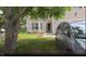 Well maintained home with a covered front porch, large front yard, and driveway at 3207 Geary Trl, Raleigh, NC 27610