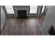 Spacious living room featuring a fireplace, lots of natural light, and beautiful flooring at 3207 Geary Trl, Raleigh, NC 27610