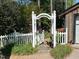 Backyard gate with arbor featuring a picket fence and stone path at 36A Country Club Dr, Rocky Mount, NC 27804