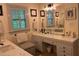 Bright bathroom boasts a large mirror, double sinks, and framed art at 36A Country Club Dr, Rocky Mount, NC 27804