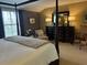 Spacious bedroom features a four-poster bed and dark wood furniture at 36A Country Club Dr, Rocky Mount, NC 27804