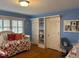 Blue bedroom features a daybed, built-in shelves, and a work desk at 36A Country Club Dr, Rocky Mount, NC 27804