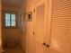 Hallway with multiple closets featuring louvred doors and brass hardware at 36A Country Club Dr, Rocky Mount, NC 27804