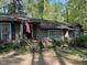 Inviting exterior of home with brick accents, a cozy front porch, and beautifully landscaped front yard at 36A Country Club Dr, Rocky Mount, NC 27804