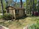 Exterior shot of a wooden storage shed in a landscaped yard at 36A Country Club Dr, Rocky Mount, NC 27804