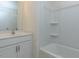 Neat bathroom featuring a single sink, vanity and tub-shower combination at 417 Hipwood Dr, Zebulon, NC 27597