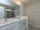 Bright bathroom featuring a double sink vanity, large mirror, and tile shower with glass doors at 417 Hipwood Dr, Zebulon, NC 27597