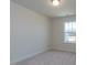 Cozy bedroom with a bright window and neutral carpet, perfect for relaxation at 417 Hipwood Dr, Zebulon, NC 27597