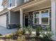 Up close view of the home's entrance, showcasing stone accents and manicured landscaping at 417 Hipwood Dr, Zebulon, NC 27597
