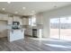 Modern kitchen featuring stainless steel appliances, white cabinets, and a sliding glass door at 417 Hipwood Dr, Zebulon, NC 27597