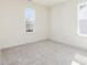 Bedroom with carpet, base molding, and windows providing plenty of natural light at 425 Hipwood Dr, Zebulon, NC 27597