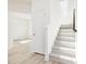 Inviting entryway with light wood flooring, a staircase, and a convenient coat closet at 425 Hipwood Dr, Zebulon, NC 27597