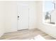 Inviting entryway with natural light, showcasing modern flooring and a clean design at 425 Hipwood Dr, Zebulon, NC 27597