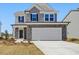 Charming two-story home with stone accents and a spacious two-car garage at 425 Hipwood Dr, Zebulon, NC 27597