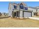 Stylish two-story home featuring a well-maintained lawn and appealing curb appeal at 425 Hipwood Dr, Zebulon, NC 27597