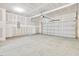Spacious unfinished garage featuring concrete floor and ample room for storage and parking at 425 Hipwood Dr, Zebulon, NC 27597