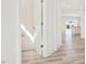 Bright hallway leading to an open kitchen with modern cabinets and appliances at 425 Hipwood Dr, Zebulon, NC 27597